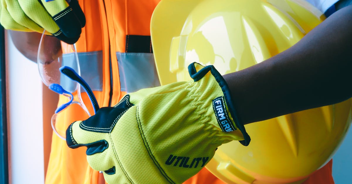 Close-up of personal protective equipment including gloves and helmet, essential for safety.